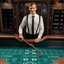 Live blackjack table at ags9 Nolimit City studio with dealer and multiple player seats visible on mobile screen